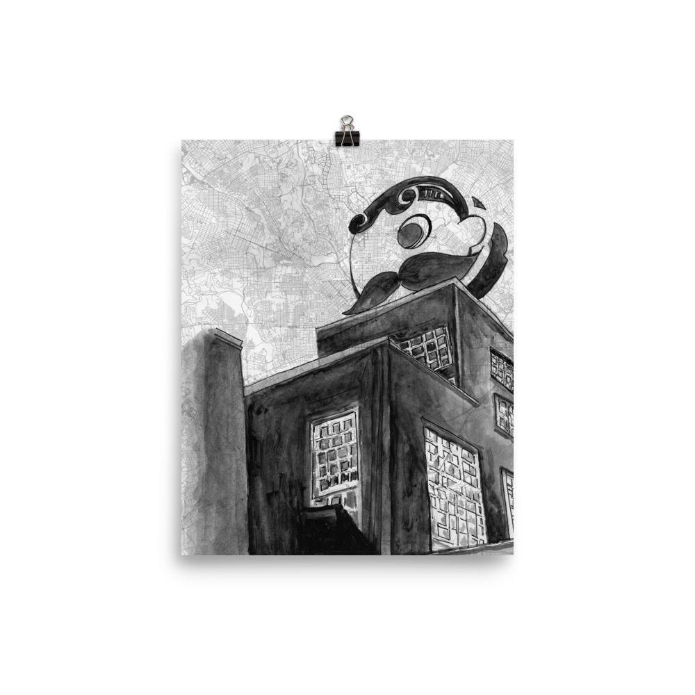 A picture of a 8x10 fine art print of a watercolor painting of Baltimore's Natty Boh Tower on a map of the city