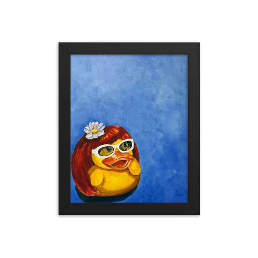 8x10 Framed print of a rubber duck wearing a wig with a white flower on top and white glasses. Framed in black