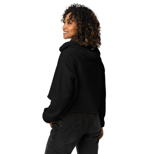 back view of a woman wearing a black cropped hoodie with yellow rubber duck logo on center chest