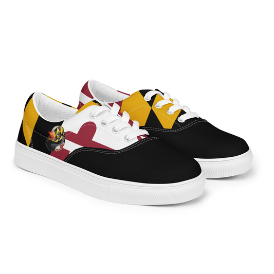 front side view of women's lace up canvas shoes with Maryland flag pattern, BMORE DUCKS! logo, white soles, and black toes