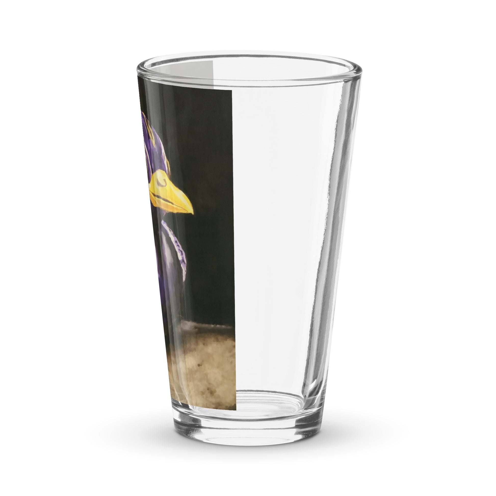 Left Side view of a pint glass with a print of a painting of a rubber duck in black and purple