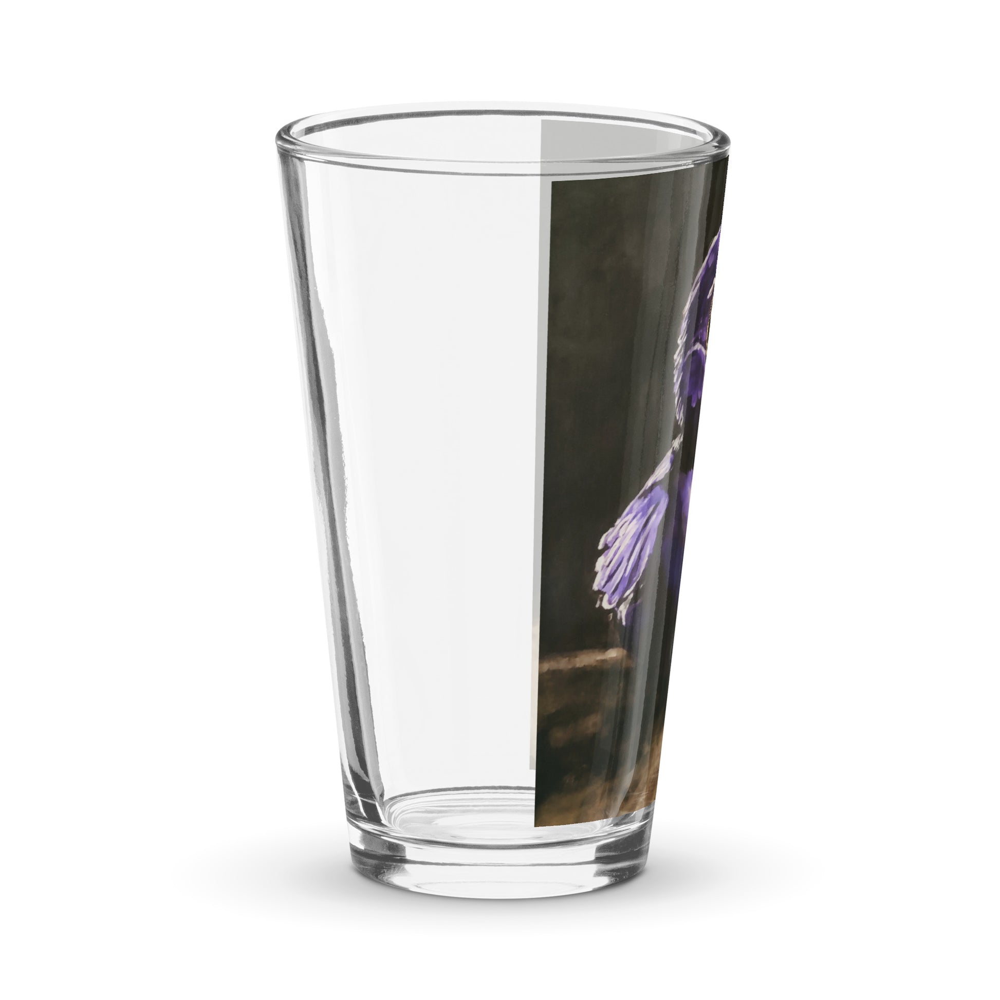 right side view of a pint glass with a print of a painting of a rubber duck in black and purple