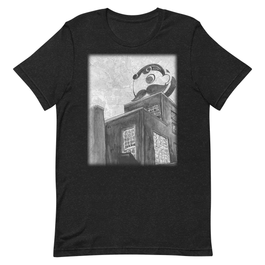 Picture of a black heather t-shirt with a printed image of a painting of Baltimore's Natty Boh Tower painted on a map of the city