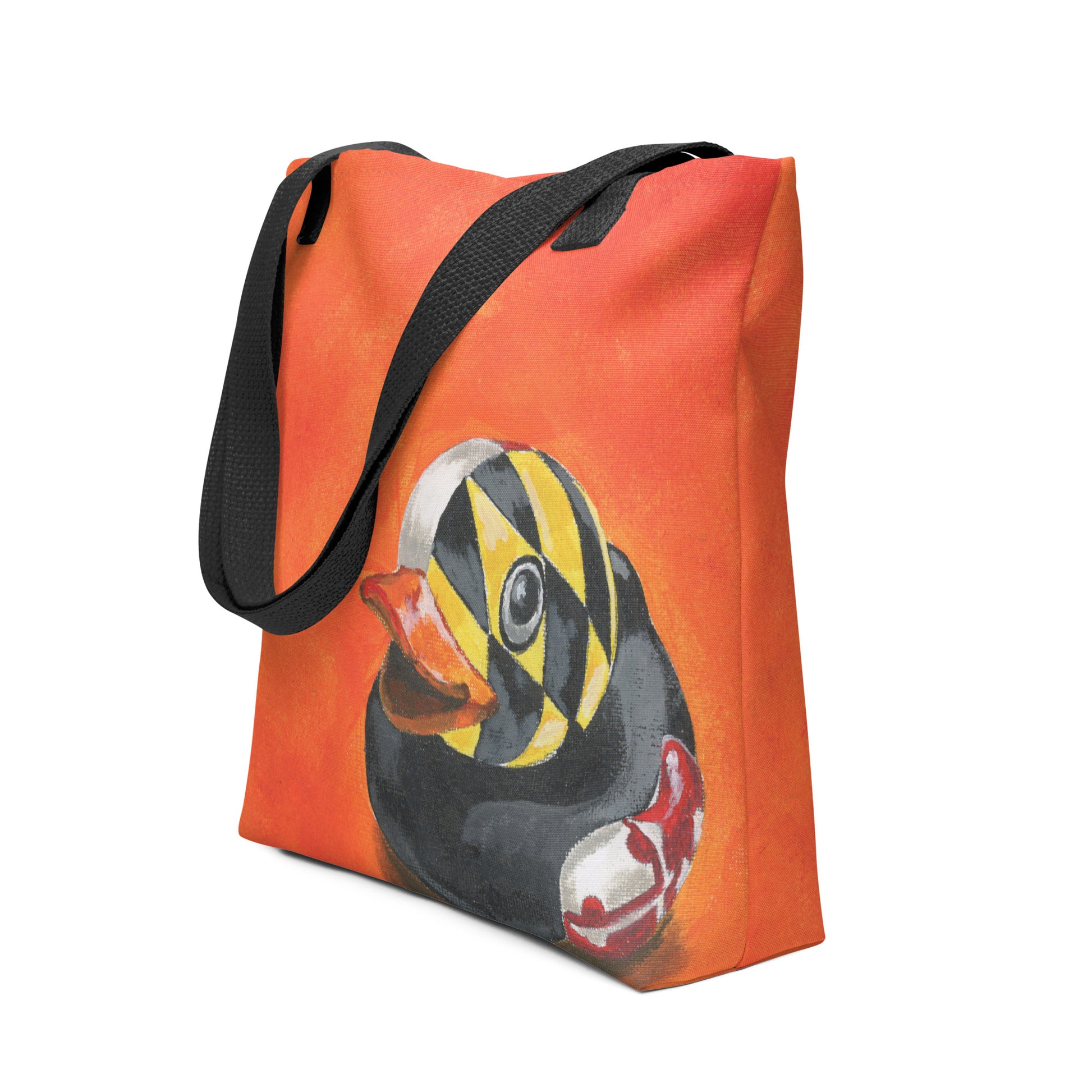 an orange tote bag with a painted rubber duck with a Maryland flag overlay