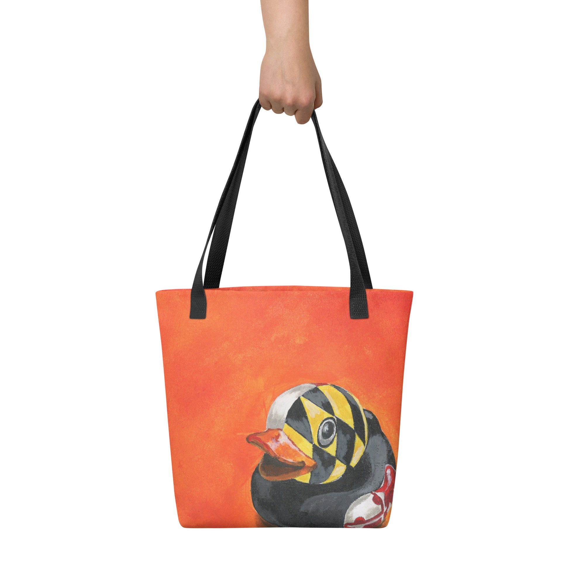 an orange tote bag with a painted rubber duck with a Maryland flag overlay