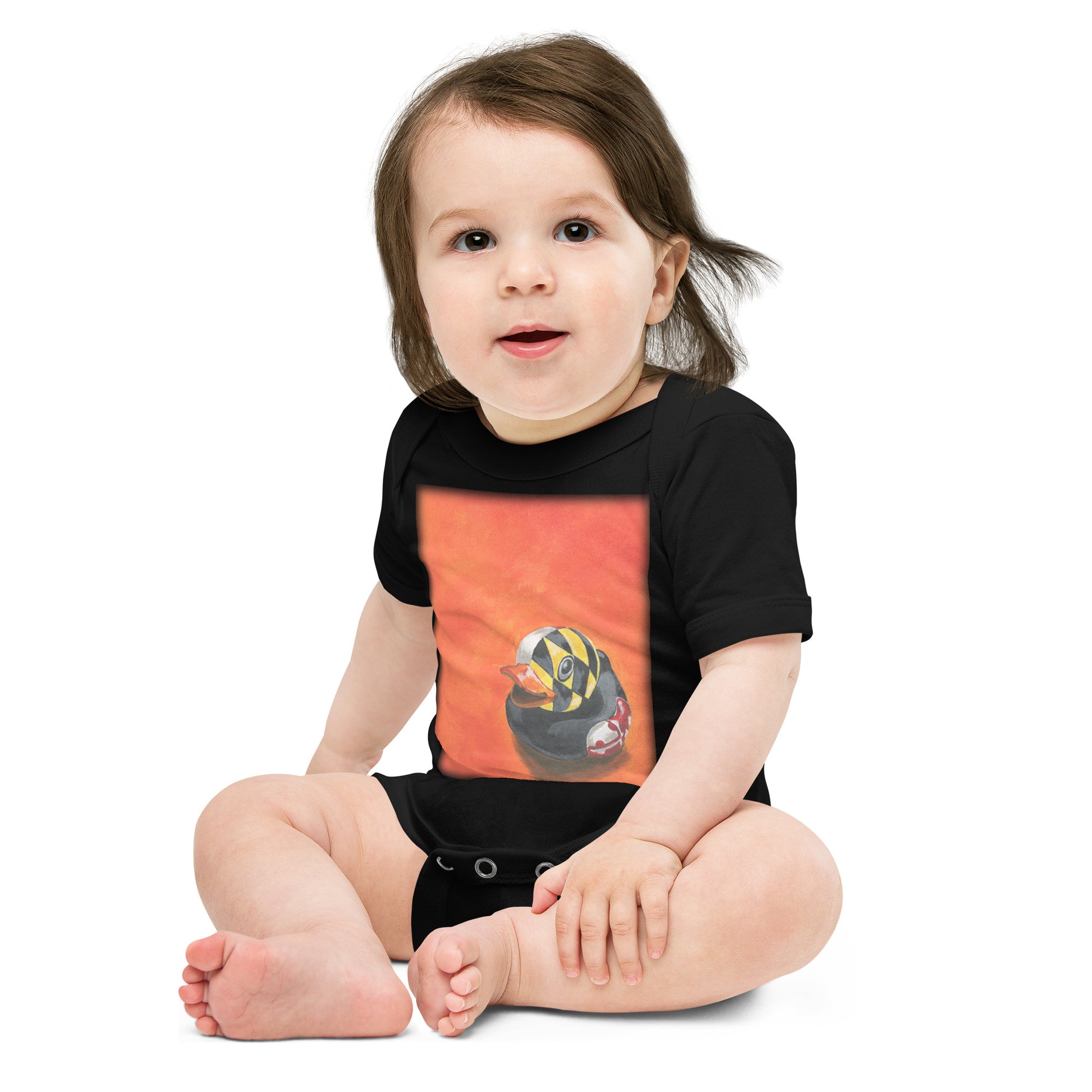 baby wearing onesie in black with a painting of a rubber duck and the Maryland flag overlay in front of an orange background