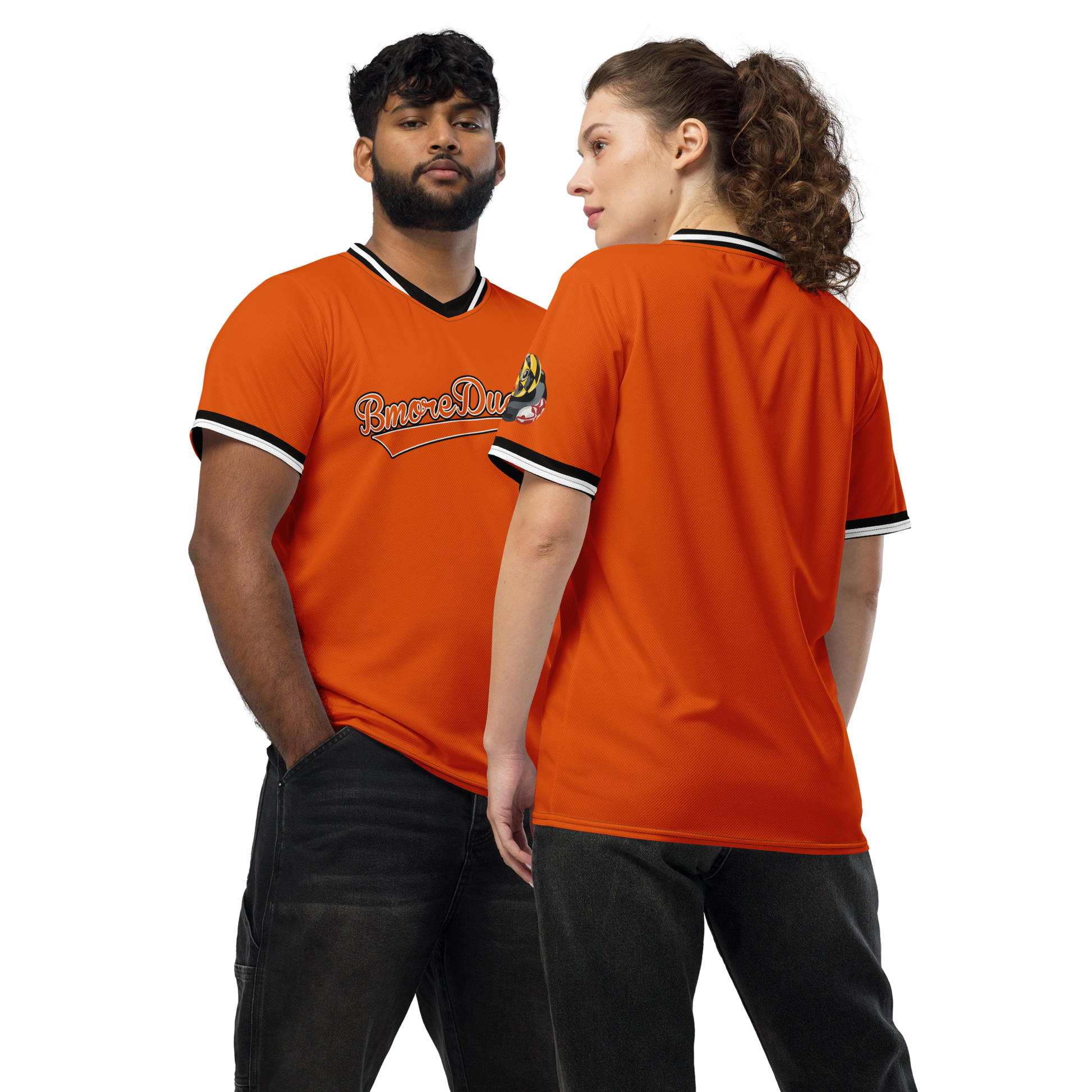 a couple modeling a orange BMORE DUCKS! baseball style jersey with script team name and logo of a rubber duck with Maryland state flag overlay