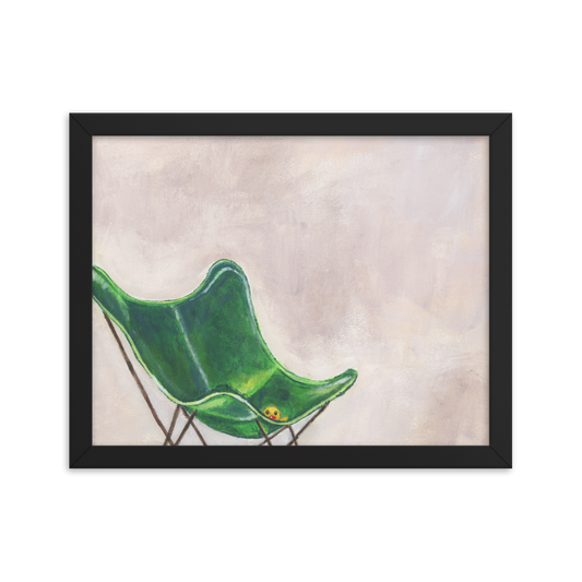 11x14 Framed print of a rubber duck sitting in a green butterfly chair. framed in black