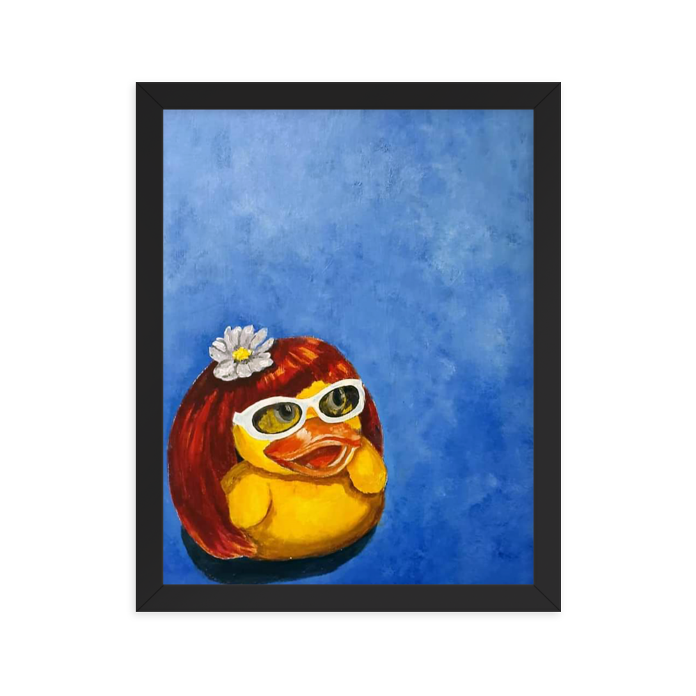 11x14 Framed print of a rubber duck wearing a wig with a white flower on top and white glasses. Framed in black