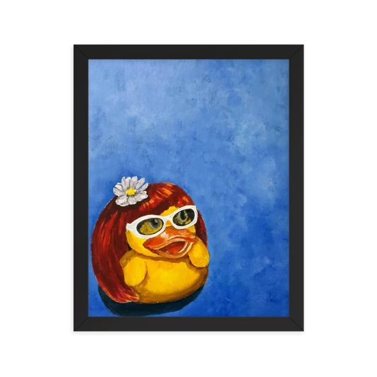 11x14 Framed print of a rubber duck wearing a wig with a white flower on top and white glasses. Framed in black