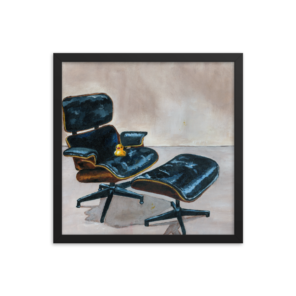 16x16 Framed print of a rubber duck sitting in a black Eames chair. Framed in black