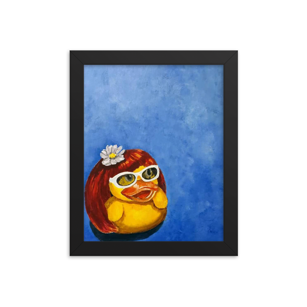 8x10 Framed print of a rubber duck wearing a wig with a white flower on top and white glasses. Framed in black