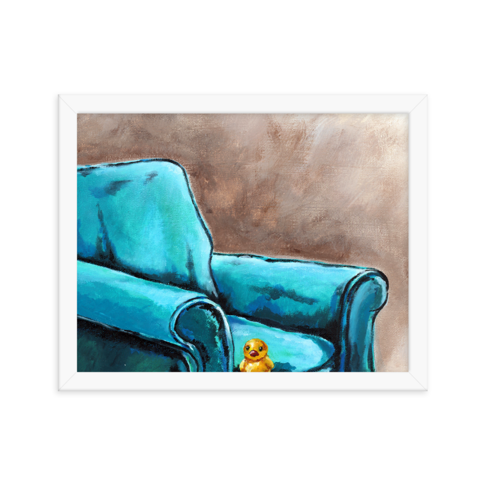 11x14 Framed print of a painting of a rubber duck sitting in a blue arm chair. Framed in white