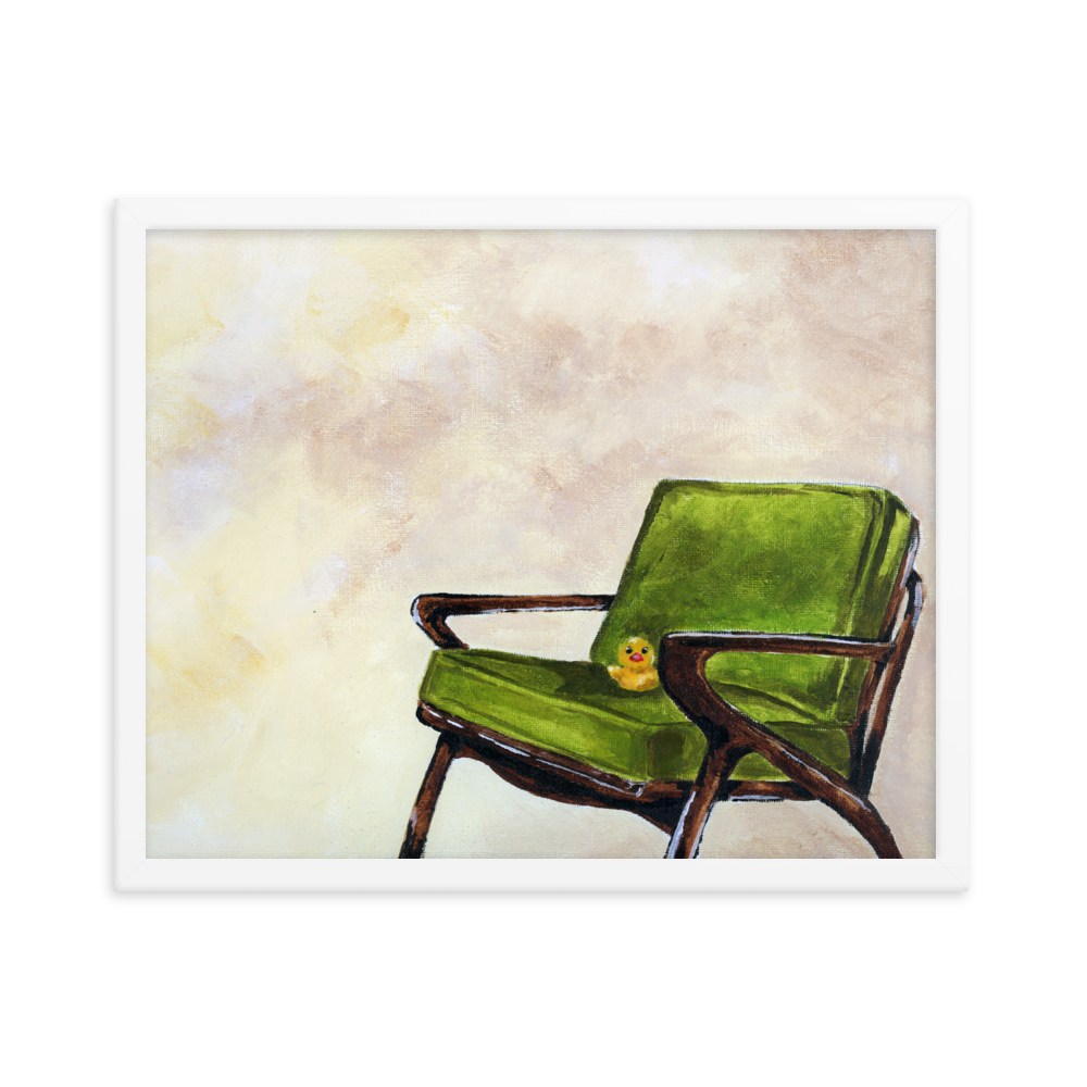 16x20 Framed print of a rubber duck sitting in a green mid century arm chair. Framed in white