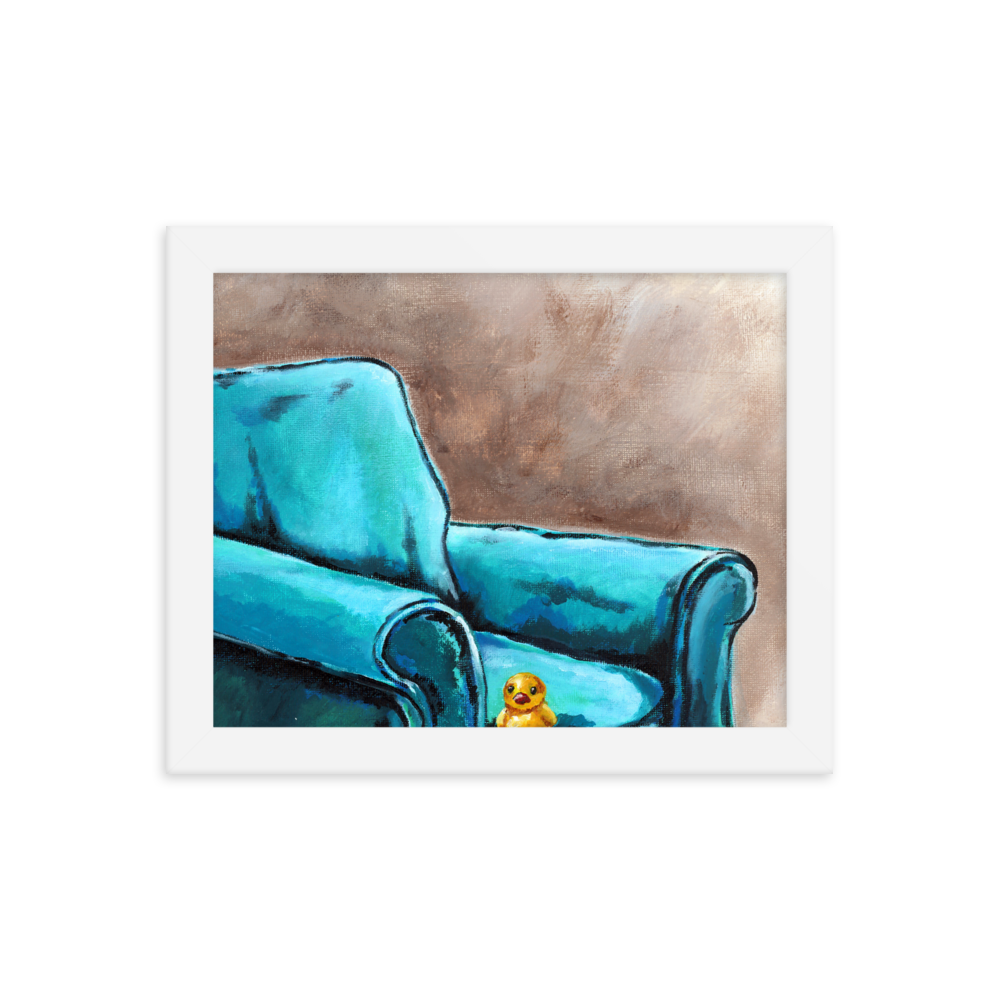 8x10 Framed print of a painting of a rubber duck sitting in a blue arm chair. Framed in white