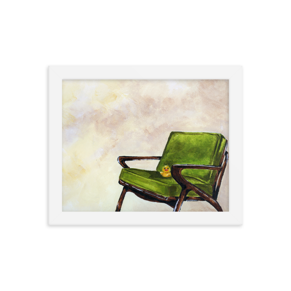 8x10 Framed print of a rubber duck sitting in a green mid century arm chair. Framed in white