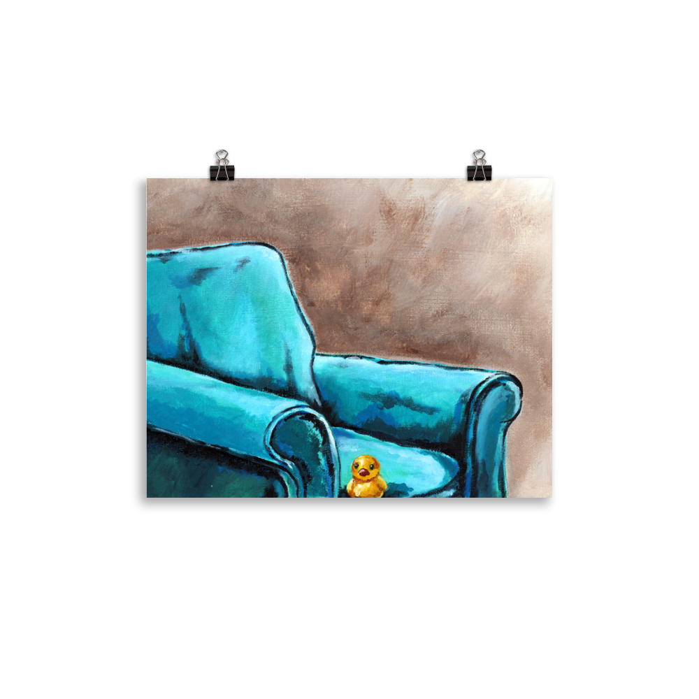 11x14 print of a painting of a rubber duck sitting in a blue arm chair.