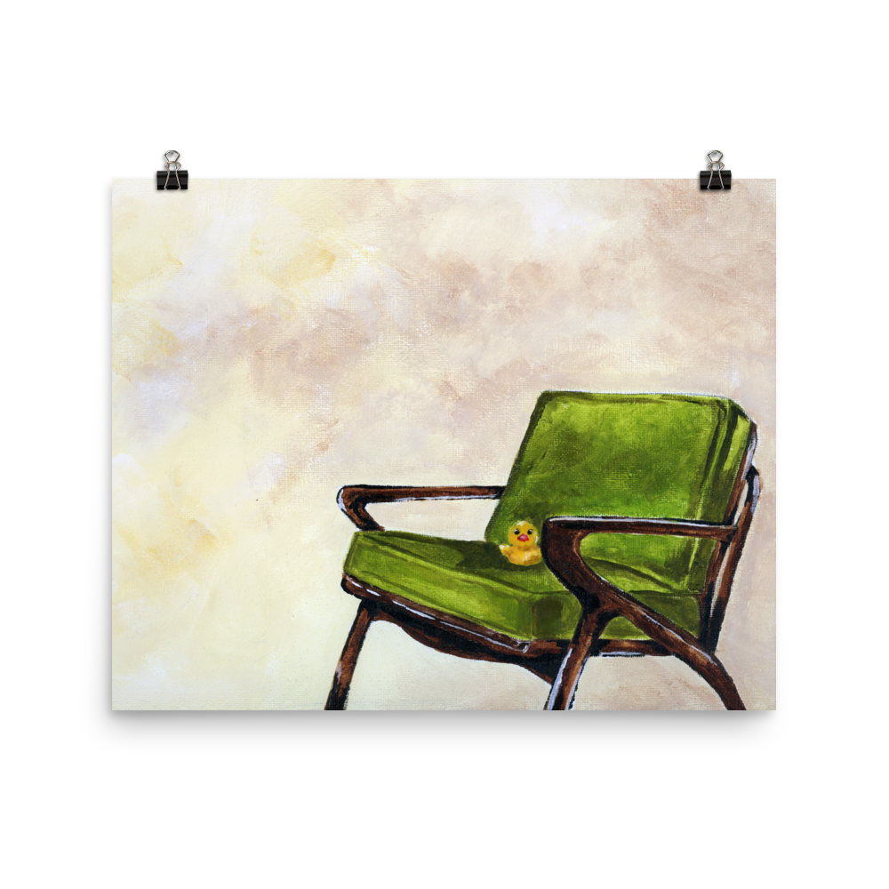 16x20 print of a rubber duck sitting in a green mid century arm chair.