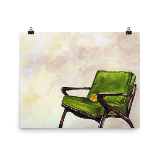 16x20 print of a rubber duck sitting in a green mid century arm chair.