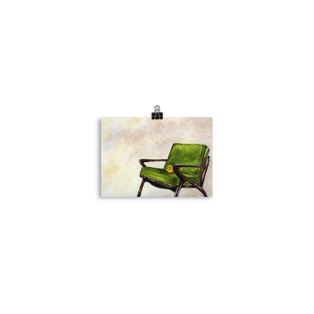 5x7 print of a rubber duck sitting in a green mid century arm chair.