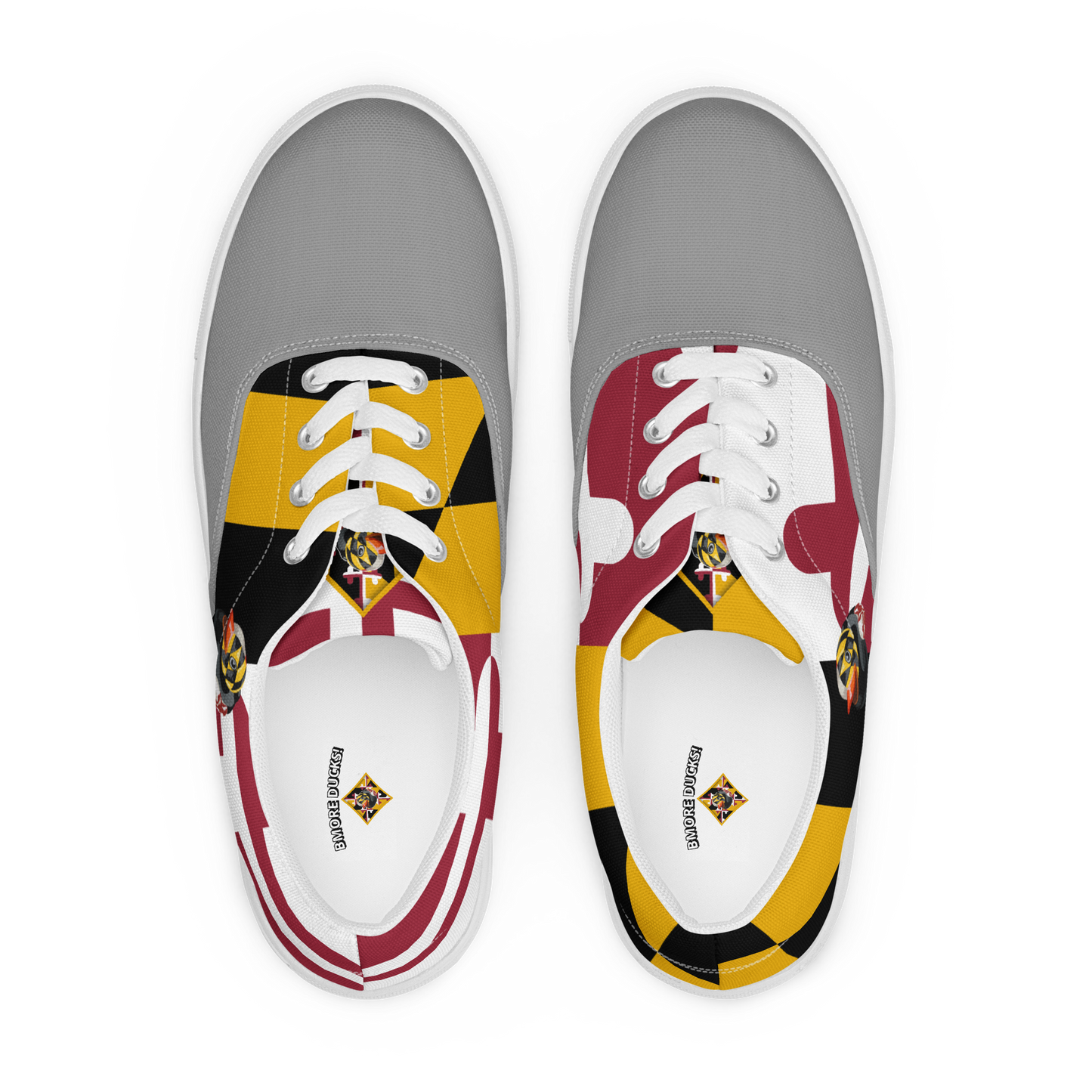 overhead view of men's lace up canvas shoes with Maryland flag pattern, BMORE DUCKS! logo, white soles, and gray toes