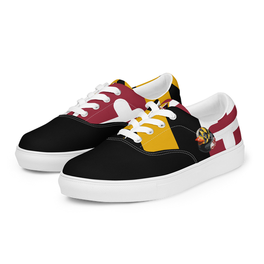 side view of men's lace up canvas shoes with Maryland flag pattern, BMORE DUCKS! logo, white soles, and black toes