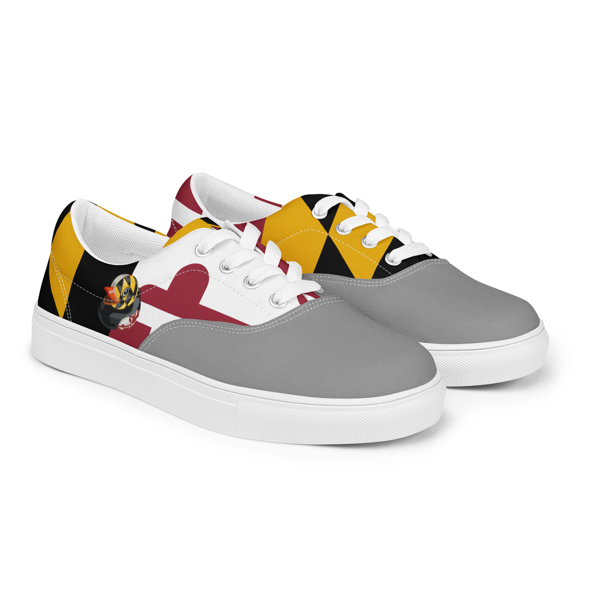 front side view of men's lace up canvas shoes with Maryland flag pattern, BMORE DUCKS! logo, white soles, and gray toes