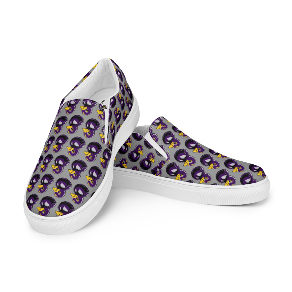 right over left side view of mens slip-on canvas shoes with a black and purple rubber duck logo pattern over gray background