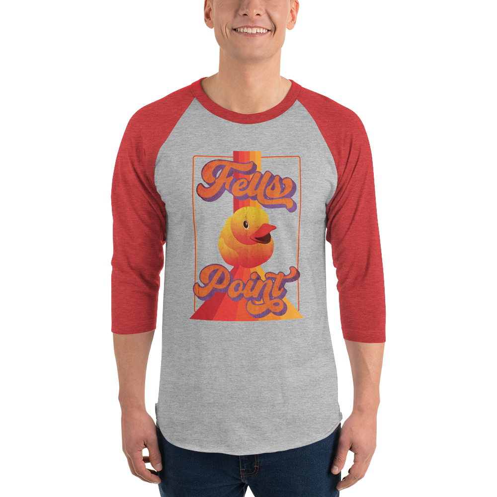 man wearing a red sleeve, gray centered raglan shirt with a vintage 1970's design that says "Fells Point" and  features a yellow rubber duck