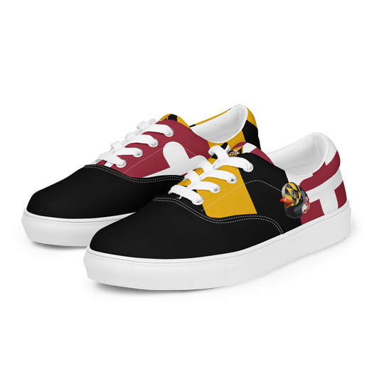 front side view of women's lace up canvas shoes with Maryland flag pattern, BMORE DUCKS! logo, white soles, and black toes